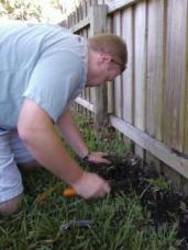 Irrigation contractor checks a valve box in Golden Glades