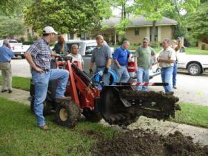 our Miami Gardens irrigation contractors are using the trencher for a new sprinkler installation